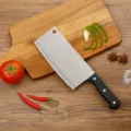 Stainless steel kitchen cleaver knife with ergonomic black handle for home cooking and slicing. - Premium Slicing Knives