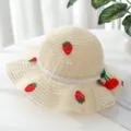 Cute girls straw sun hat with sweet crochet strawberry mesh bow design for summer beach. - Recommended Age: 3-7 Years + Cap Circumference: 52-54 cm / Off White
