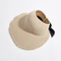 Women summer straw sun visor hat empty top wide brim rollable beach cap with black bow. - Beige
