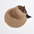 Woven straw sun visor for women, summer empty top beach hat with black bow, foldable design. - Khaki