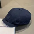 Detailed view of dark blue cotton newsboy cap, classic stitching, casual retro hat style. - M (56-58cm) / Dark Blue