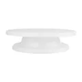 White plastic cake turntable stand for baking, revolving design for decorating cakes easily. - White