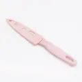 Portable pink fruit knife with protective sheath and handle hole for kitchen use. - Pink