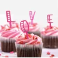 Pink acrylic LOVE cupcake toppers with heart cutouts, perfect for Valentine's Day. - Mirror Rose Red LOVE Style