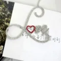 Close-up detail of rhinestone love cake topper with red heart for romantic party decor. - Red Small Heart LOVE / Width Approx 8CM