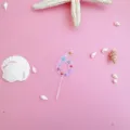 Pink acrylic number 6 cake topper with ocean shell details, detailed view for party decoration. - 6 / S