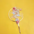 Close-up detail of the traditional Chinese dragon acrylic cake topper with colorful cloud patterns. - Dragon Design (With Stick) / Height ~16.5CM