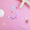 Pink number 5 acrylic cake topper with ocean shell and starfish print for birthday party. - 5 / L