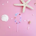 Pink acrylic number 0 cake topper with ocean shell and starfish design for birthday. - L