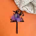 Halloween acrylic cake topper detail showing black haunted house shape with purple web decor. - Haunted House Mood (Purple Mist)