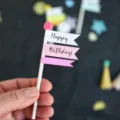 Minimalist cake topper with happy birthday flags for sweet party dessert decoration. - Pom Pom Flag Topper / Pink