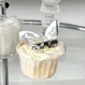 Silver acrylic butterfly cake topper engraved with anniversary design for party decor. - Butterfly Happy Anniversary / Silver
