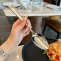 Detailed view of the 304 stainless steel long handle spoon, sleek polished finish tableware. - Dinner Spoon