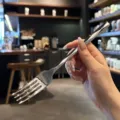 Stainless steel dinner fork detail close-up showcasing luxury diamond cut handle design and polish. - Dinner Fork