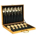 Luxury stainless steel cutlery set with gold finish and dark handles in gift box detail - 24-Piece Dark Green and Gold Cutlery Gift Box Set