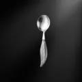 Stainless steel spoon with elegant feather handle, 304 material, perfect for western dining. - Round Spoon / Silver