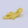 Fishing rod hook keeper plastic lure accessory detail view, essential small tackle tool. - Yellow