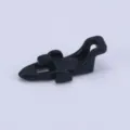 Detailed view of black plastic fishing rod lure hook keeper accessory for sea fishing gear. - Black