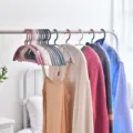 Durable plastic clothes hangers with wide shoulder non slip design for home dorm wardrobe. - Blue