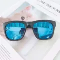 Women's fashion square sunglasses with blue reflective lenses and black frames for daily wear. - Glossy Black Frame with Ice Blue Mirror Lenses