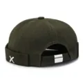 Dark green brimless cap, stylish street miki hat with metal X accent, adjustable back strap. - Army Green