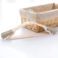 Beige plastic clothes hanger with anti-slip shoulder pads and pants bar, variant sku. - Nordic Beige