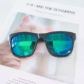 Women fashion sunglasses with colorful reflective lenses and classic black frames for outdoor wear. - Sand Black / Green Mirror