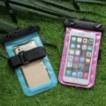 Universal waterproof phone pouch with strap for swimming, beach and outdoor water sports. - Purple