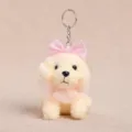 Cute plush poodle dog keychain pendant with pink bow and lace collar variant accessory. - Bow knot Yellow / Sitting Teddy Dog with Bow Tie - Yellow