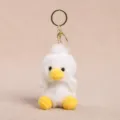 Cute fluffy white plush duck keychain variant featuring yellow beak and golden metal ring. - White