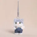 Cute grey and white plush cat keychain pendant wearing miniature denim overalls backpack charm. - Cat in Overalls - Grey