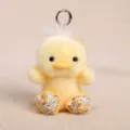Cute yellow duck plush keychain with floral feet, soft stuffed animal bag charm pendant toy. - Tiny Floral Duck