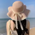 Chapeau de paille rose pour femme avec noeud en dentelle et bord ondule pour la plage. - M (56-58cm) / Rose