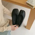 Black split-toe flat ballet shoes detail view, elegant French style footwear closeup. - 35 / Black