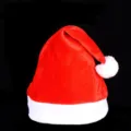 Classic red velvet Christmas hat with white plush trim and pom-pom for holiday party. - Children's Regular Hats