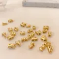 Close-up detail of gold 3D puffy alphabet letter beads, perfect for DIY jewelry making accessories. - Set of Letters A-Z