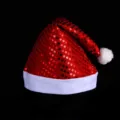 Sparkling red sequin Christmas hat featuring plush white trim for holiday party celebrations. - Sequin Hats (Random Mix)