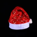Red plush Christmas hat with silver star and moon print, festive holiday party cap variant. - Silver Star & Moon