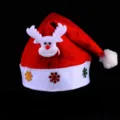 Festive plush Christmas hat featuring adorable reindeer design and glittery snowflakes for party. - Antler