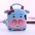 Süße Cartoon-Kuh Spardose mit Griff und Schloss, kreative Sparbüchse für Kinder. - Blau