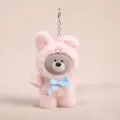 Cute plush bear keychain with vinyl face and blue bow pink doll bag cute pendant toy. - Vinyl Bear Transformed into Rabbit - Pink