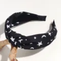 Black wide knot headband with white star and moon print, perfect detail accessory for daily wear. - Moon & Star