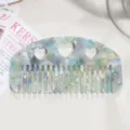 Acetate hair comb with cute heart cutouts and colorful marbled tortoiseshell design for women - Teal