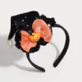 Detailed view of the Halloween witch hat headband with orange bow and cute pumpkin decor. - Orange Curved Hat