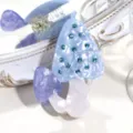 Close up view of a cute mushroom hair claw clip made of acetate with sparkling blue rhinestones. - Blue