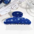 Blaue Haarklamm mit Jeans-Muster, Sternen und Pfotenabdrücken als Detailaufnahme - Pfote Stern Elliptische Haarklammer