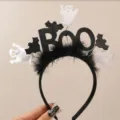 Close-up detail of Halloween ghost and bat headband with black feathers and BOO letters. - Boo Lettering