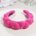 Detail shot of the pink plush braided cloud headband, showing soft texture and unique wavy shape. - Rose Red