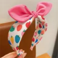 Cute pink bow headband with colorful strawberry print, sweet and stylish hair accessory. - Colorful Strawberry Pink Ears