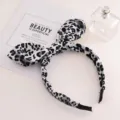 Black and white leopard print headband with cute bunny ears bow, wide anti-slip hair hoop. - Grey Leopard / Gray